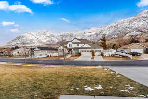 Exterior space with a mountain view and a front lawn