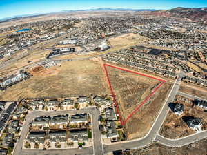 Birds eye view of property with a mountain view