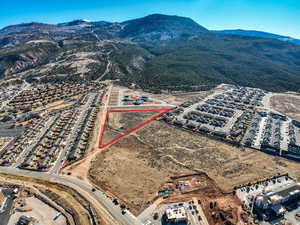 Birds eye view of property with a mountain view