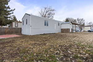 View of side of home featuring a patio