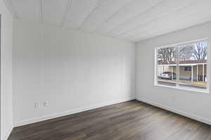 Bedroom featuring dark hardwood / wood-style floors