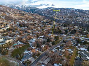 Birds eye view of property with a mountain view