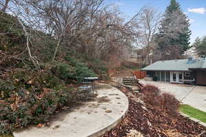 View of yard featuring cooling unit and a patio area