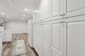 Hallway featuring light hardwood / wood-style flooring