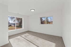 Second bedroom featuring oversized window