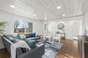 Living room featuring hardwood / wood-style floors and wooden ceiling