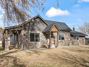 View of front of house with a front lawn