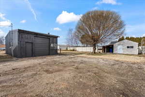 Detached oversized garage and additional storage shed