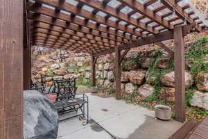 View of patio with a pergola