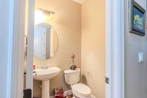 Bathroom featuring sink and toilet