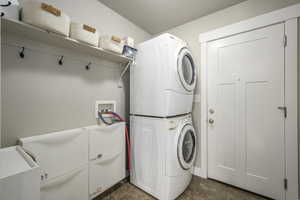 Clothes washing area with stacked washer and dryer