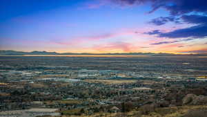 Aerial view at dusk featuring a mountain view