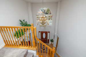 2 story Entryway featuring a elegant chandelier