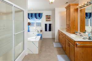 Bathroom with plus walk in shower and vanity