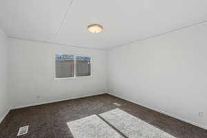 View of carpeted spare room