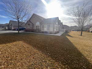 Rear view of house with a lawn