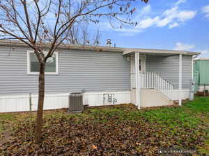 View of property exterior featuring cooling unit