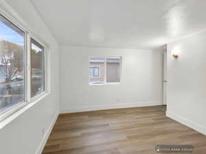 Unfurnished room with light wood-type flooring