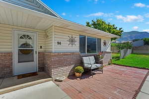 Property entrance featuring a patio area and a mountain view