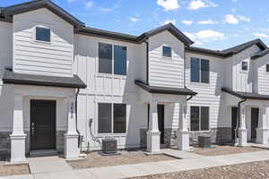 View of front facade featuring central AC unit