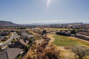 Birds eye view of property featuring a Red Rock mountain and Sunbrook Golf Course.