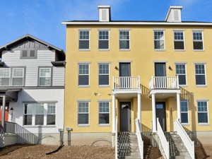 View of front of house featuring a balcony