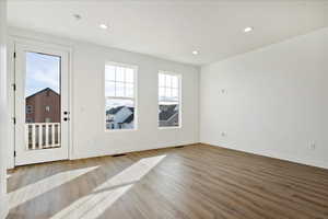 Spare room with light wood-type flooring
