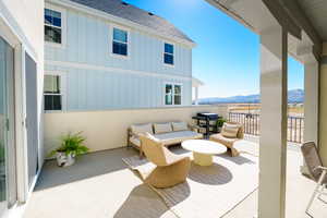 View of patio featuring a mountain view and a balcony