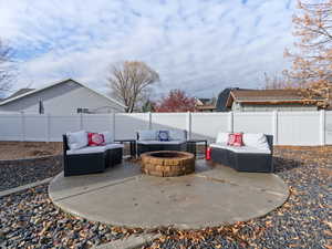 View of patio / terrace with an outdoor living space with a fire pit