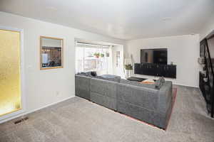 Living room featuring carpet floors