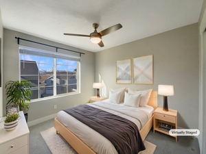 Bedroom featuring light colored carpet and ceiling fan