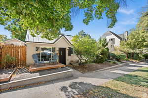 ADU View of front of property with a wooden deck