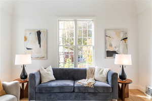 Living room featuring plenty of natural light and hardwood / wood-style floors