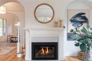 Interior details featuring hardwood / wood-style floors and a premium fireplace