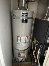 Utility room with strapped water heater