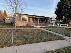 View of front of house with a porch and a front lawn