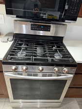 Room details with stainless steel range with gas cooktop