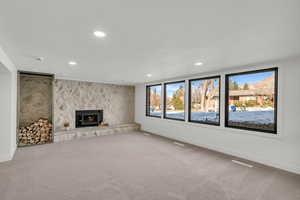 Unfurnished living room featuring carpet