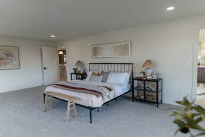 Master Bedroom featuring carpet and ensuite bathroom