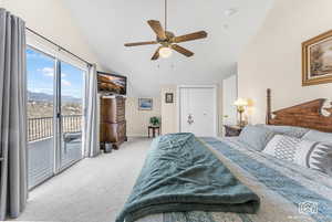 Bedroom with access to outside, ceiling fan, a closet, and lofted ceiling