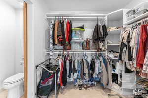 Walk in closet featuring tile patterned flooring