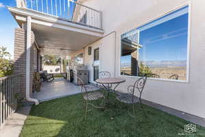 View of patio / terrace featuring a mountain view, area for grilling, and a balcony