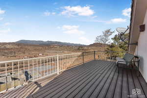 Wooden terrace featuring a mountain view