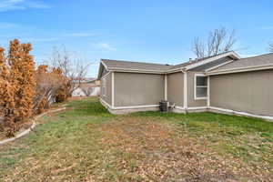 View of home's exterior with a lawn