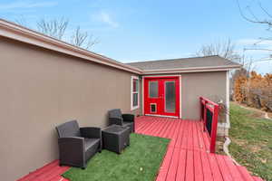 Wooden deck featuring a yard