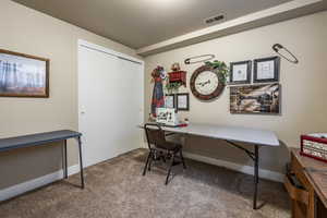 Office area featuring carpet