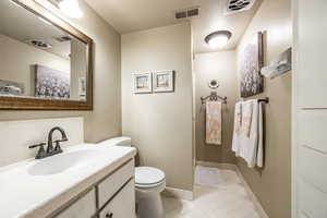 Bathroom with vanity and toilet