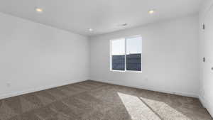 View of carpeted spare room