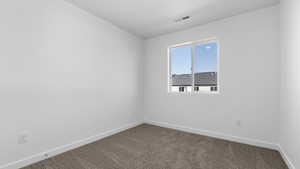 Empty room with carpet floors