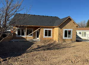 Back of property with a patio